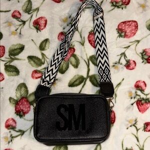 Black Crossbody Bag with Patterned Strap
